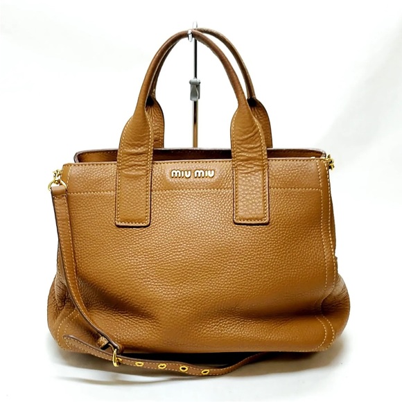 Miu Miu Handbags - Miu Miu brown hand bag with shoulder strap